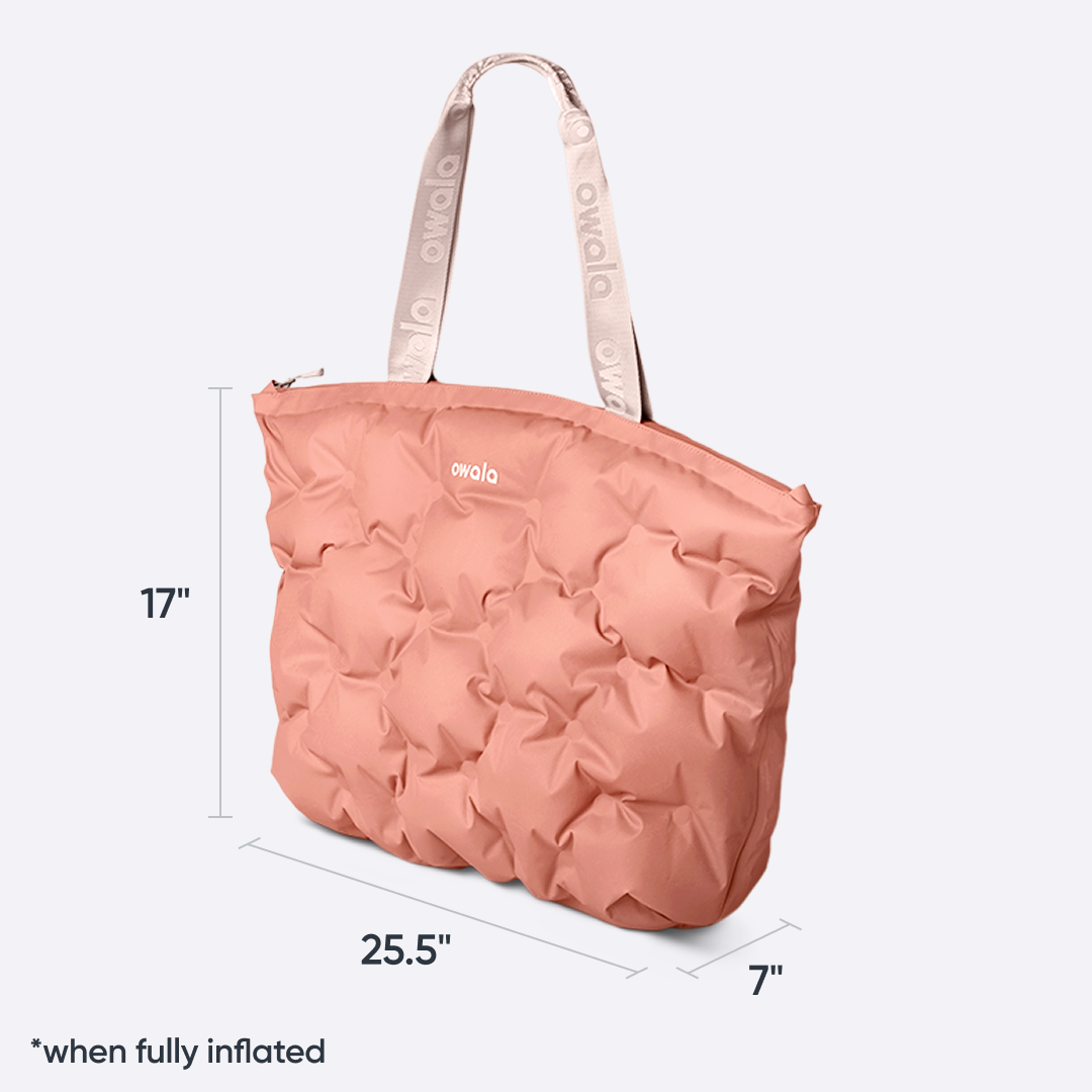 Owala Cloud Insulated Tote in Rosewood, peach pink pillowed body with cream owala-tape handles, with size dimensions 17 inches tall by 25.5 inches wide by 7 inches deep "when fully inflated"